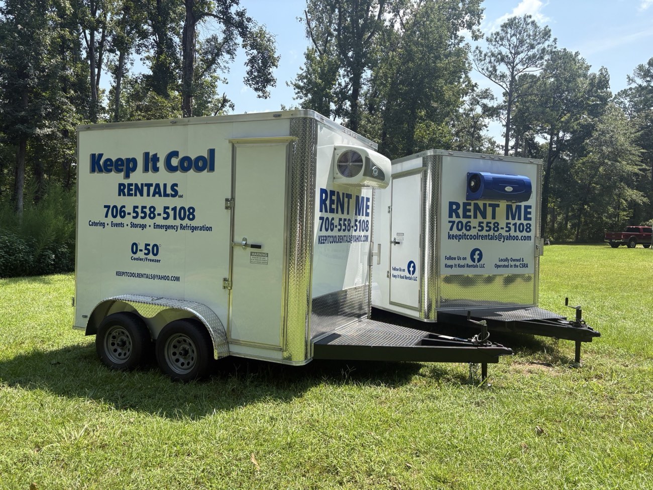 Both Keep It Cool refrigerated rental trailers parked side by side with their doors open